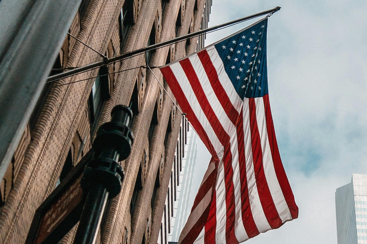 American Flag hanging off a building